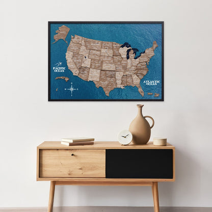 Framed map of the United States on a wall above a wooden console table.