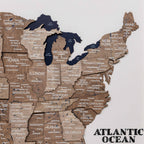 Wooden map of the United States with state names on a white background