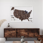 Framed map of the United States on a wall above a wooden sideboard.