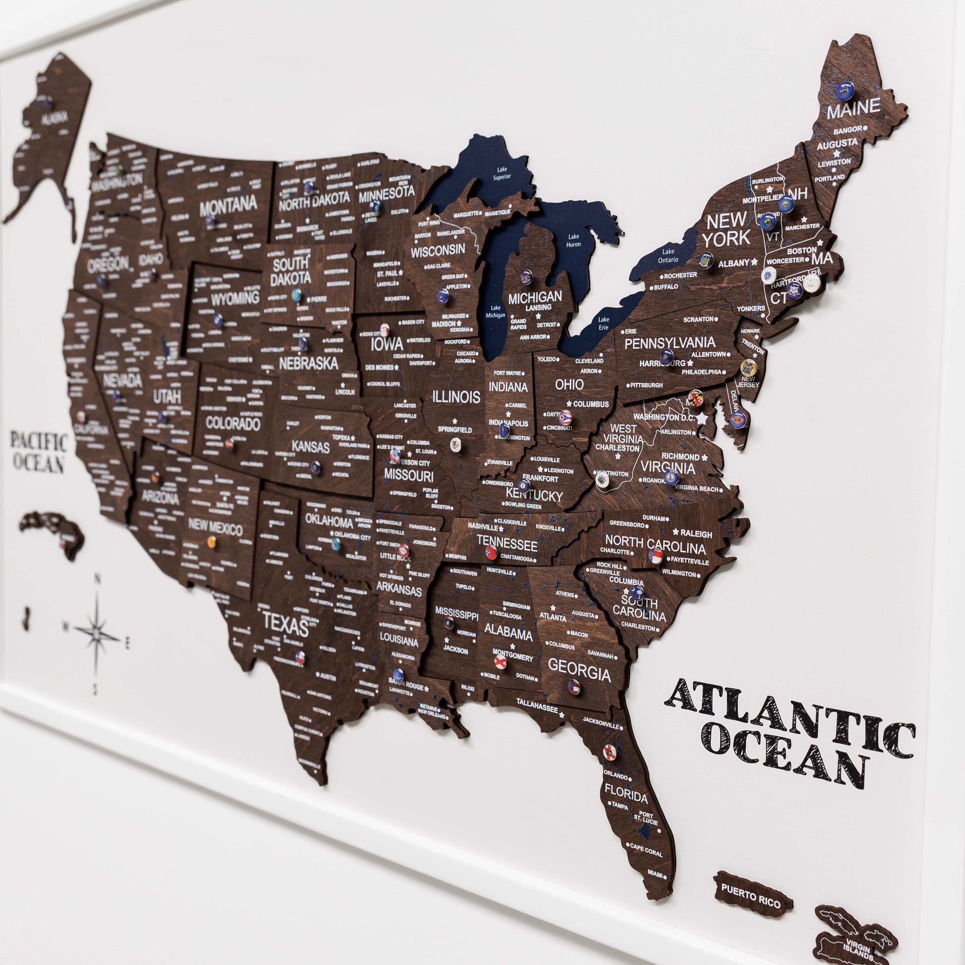 Wooden map of the United States with state names on a white background
