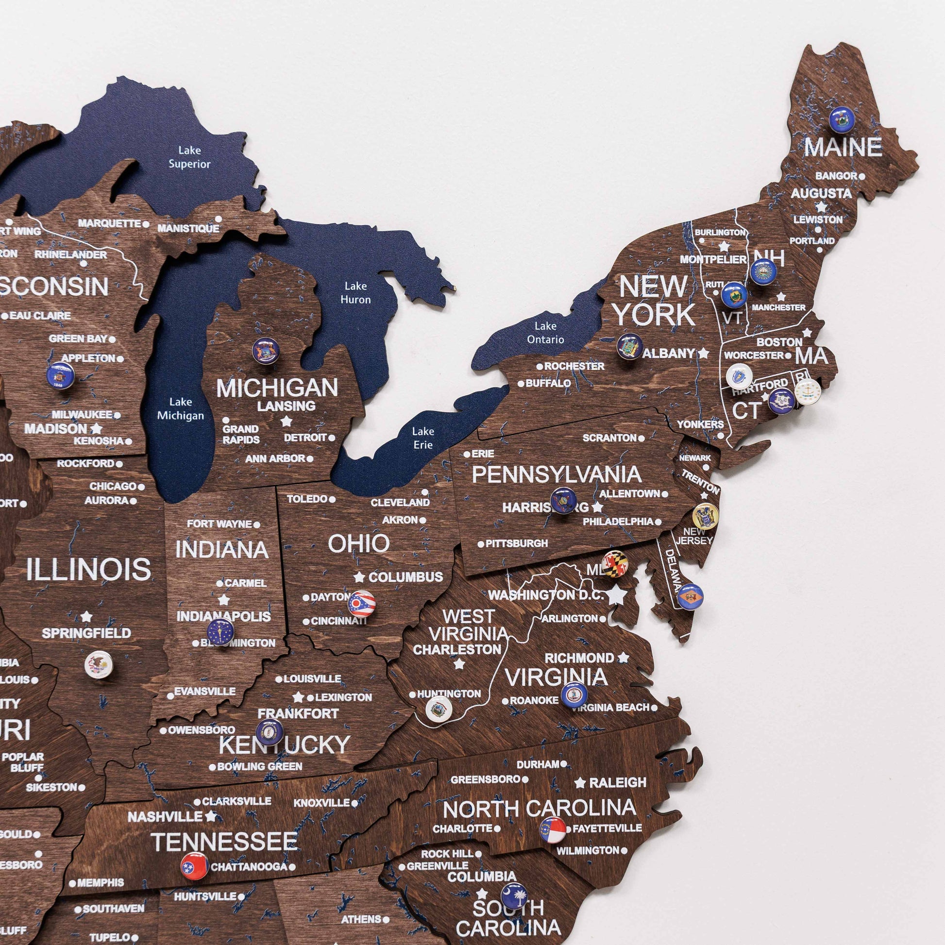 Wooden map of the United States with state names and major cities.