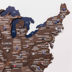 Wooden map of the United States with state names and major cities.