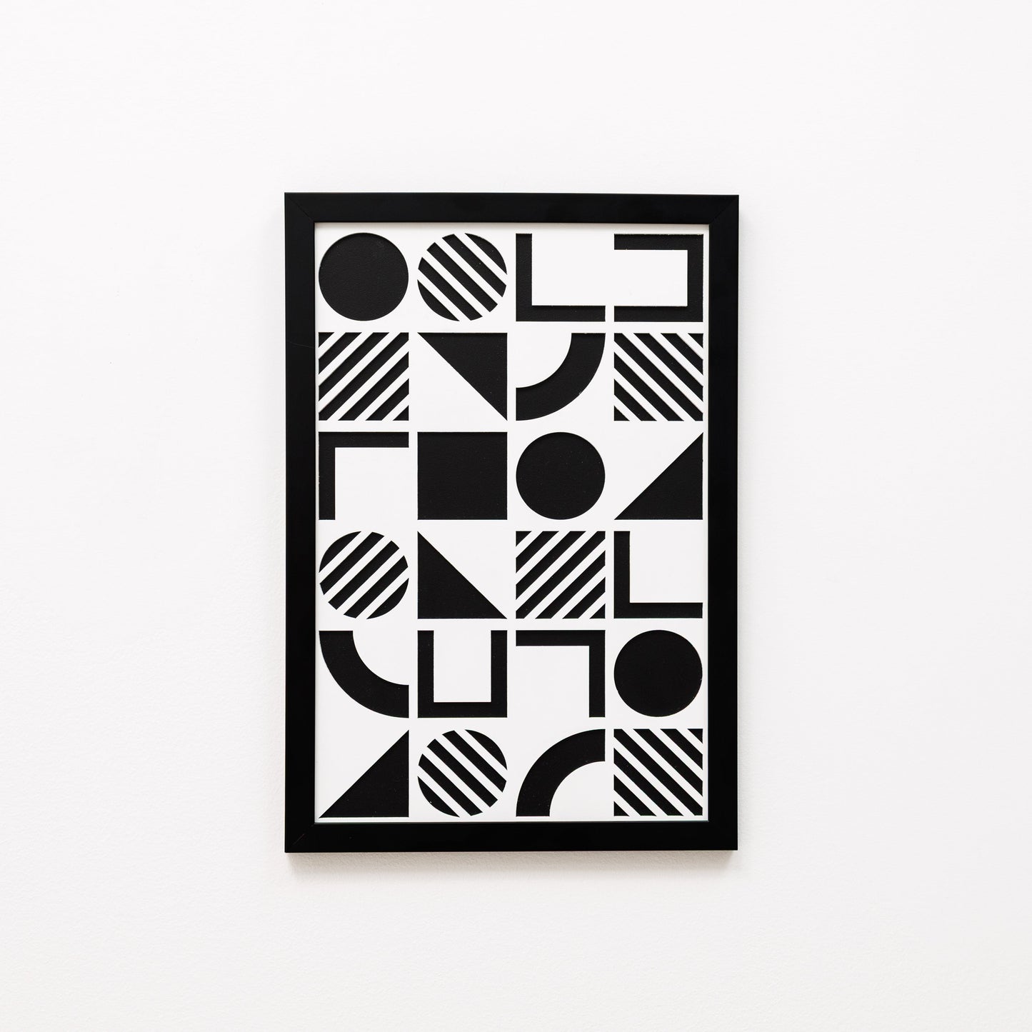 Framed black and white geometric art print on a white background