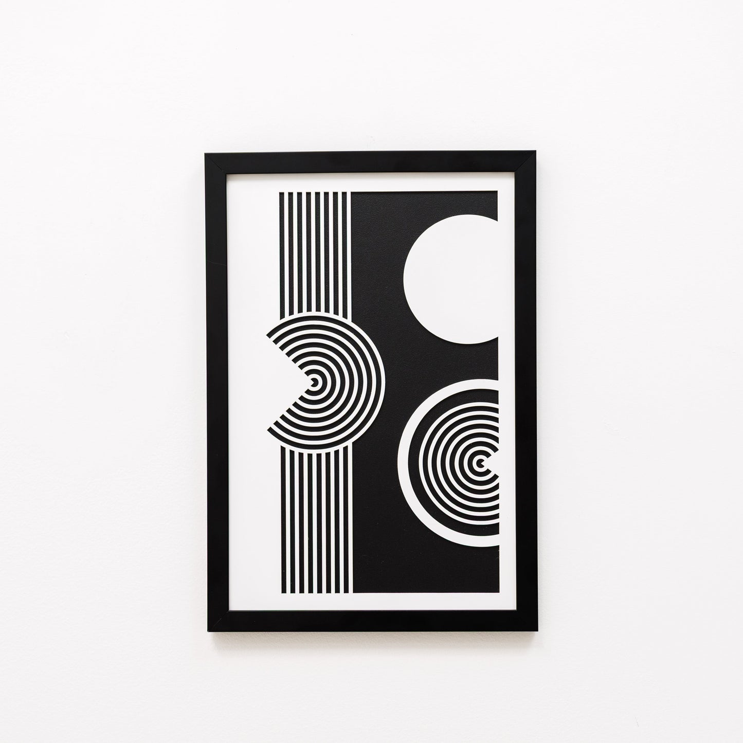Framed black and white abstract art print on a white background