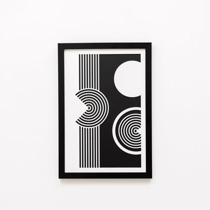 Framed black and white abstract art print on a white background