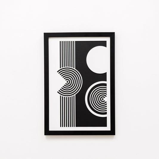 Framed black and white abstract art print on a white background
