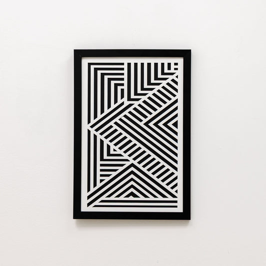 Framed black and white geometric art on a white background