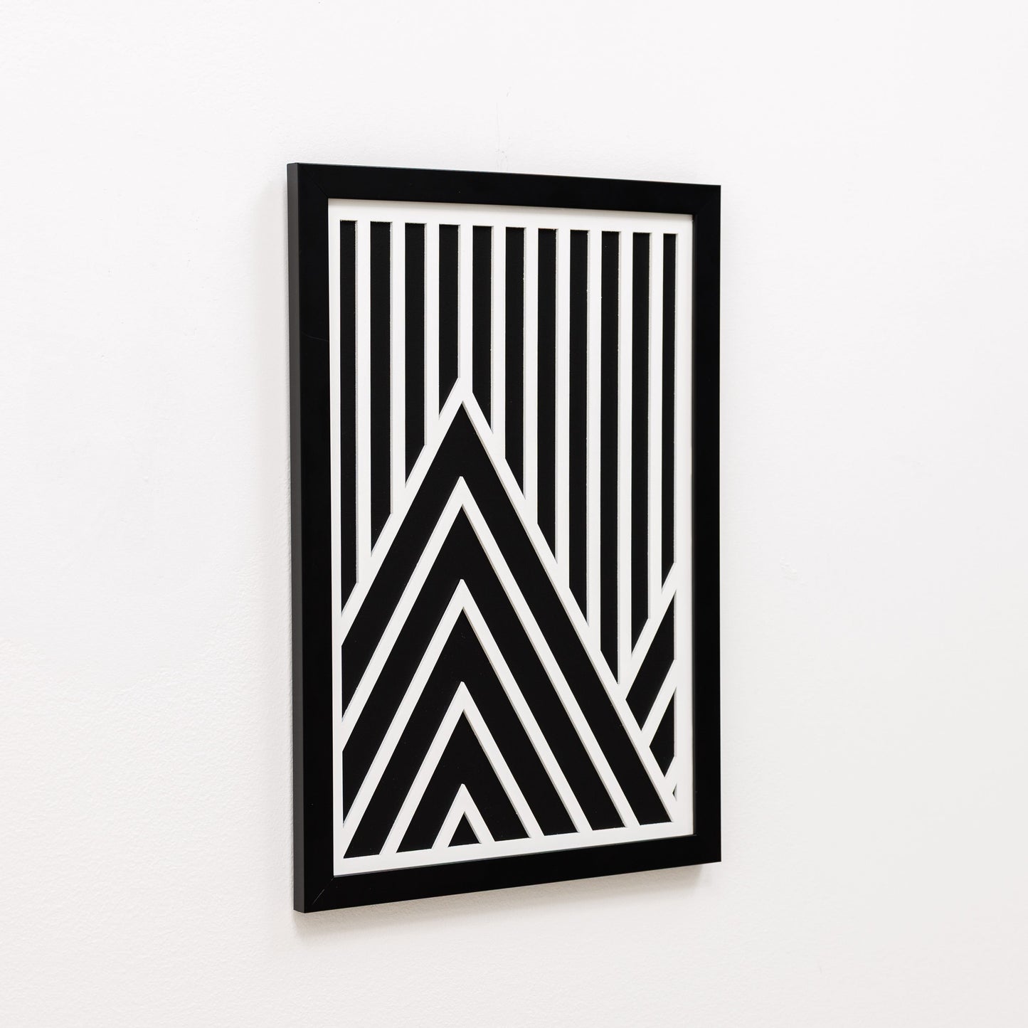 Framed black and white geometric art on a white background