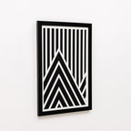 Framed black and white geometric art on a white background