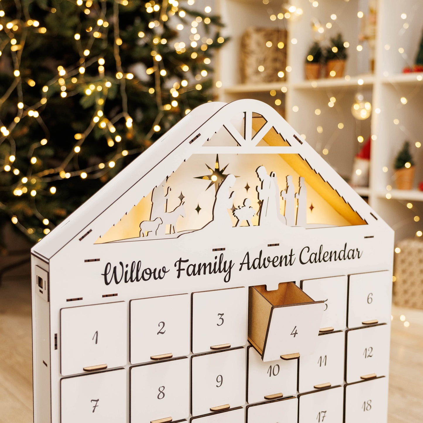 Willow Family Advent Calendar with Christmas tree and lights in the background