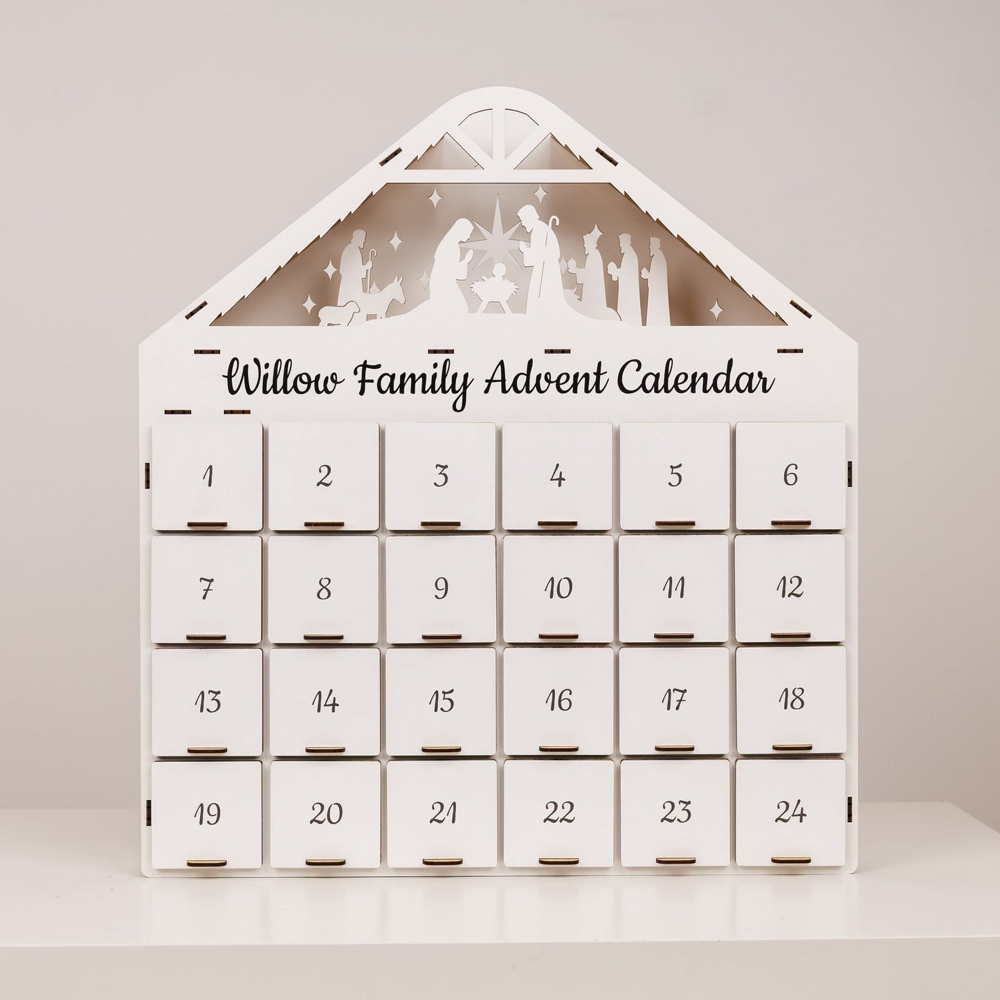 Willow Family Advent Calendar with silhouette designs on a plain background
