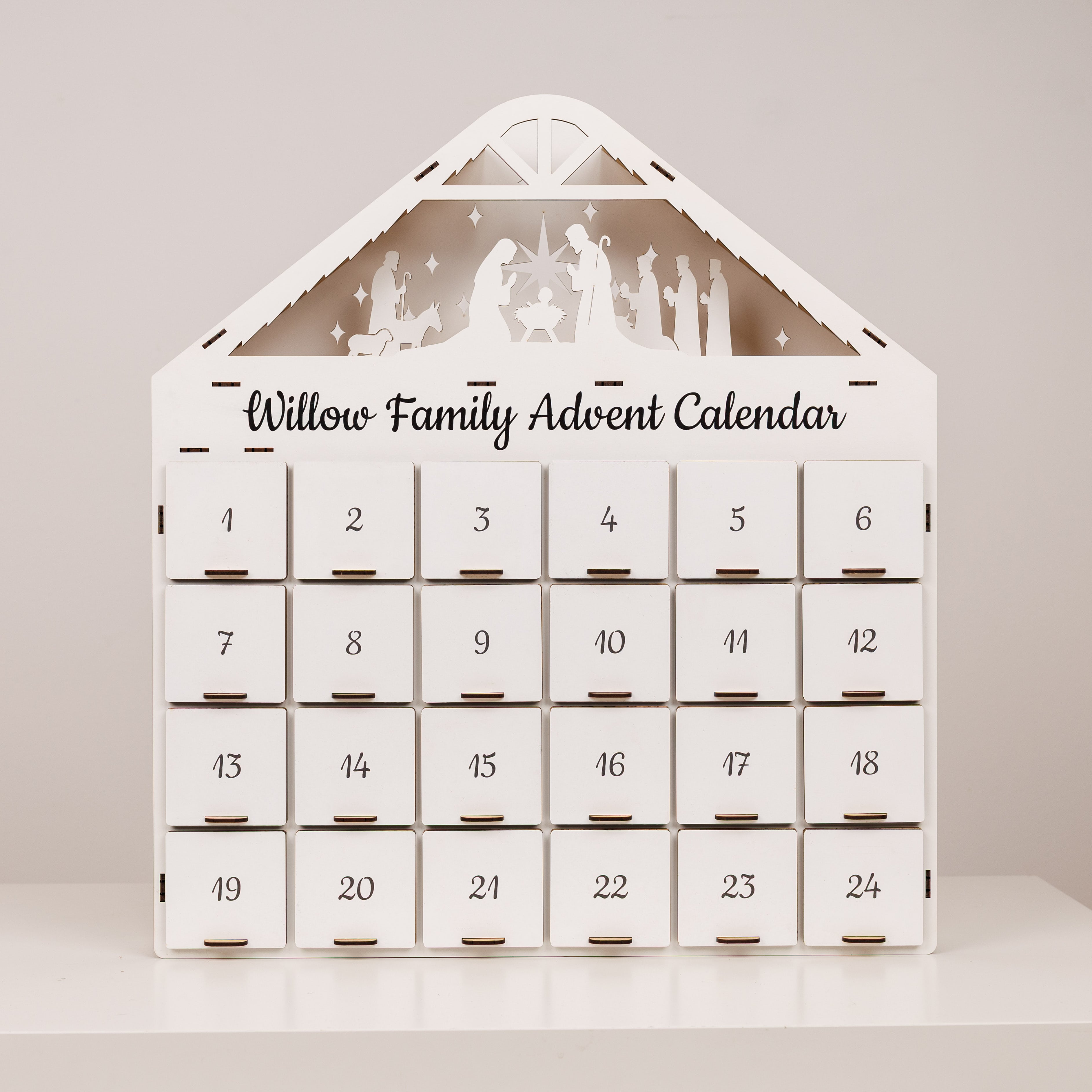 Willow Family Advent Calendar with silhouette designs on a plain background