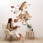 Woman sitting in a chair reading a book in a room with a large wall map of Europe.