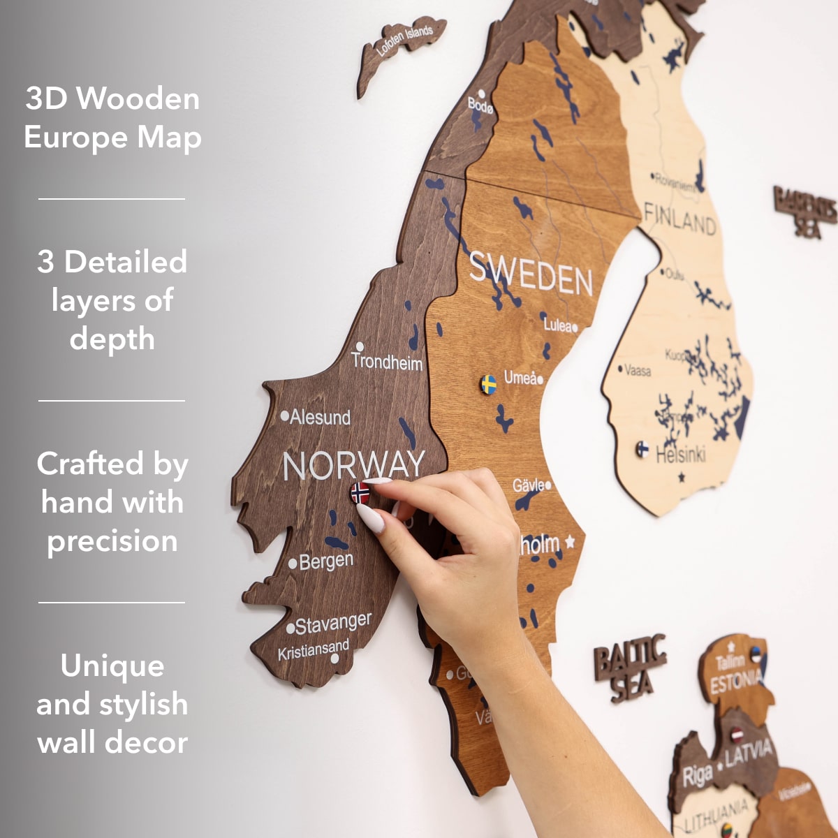 3D wooden Europe map with a hand pointing to Norway, on a light gray background.